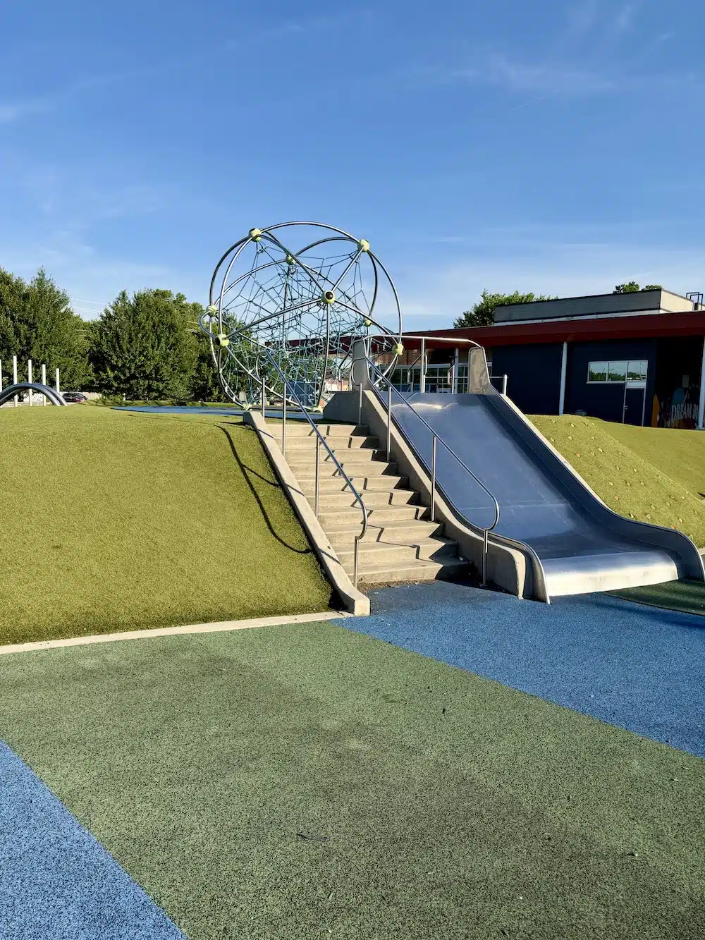 Tarkington Park & Playground in Indianapolis 4 Large metal slide built into the hill at Tarkington Park playground in Indianapolis
