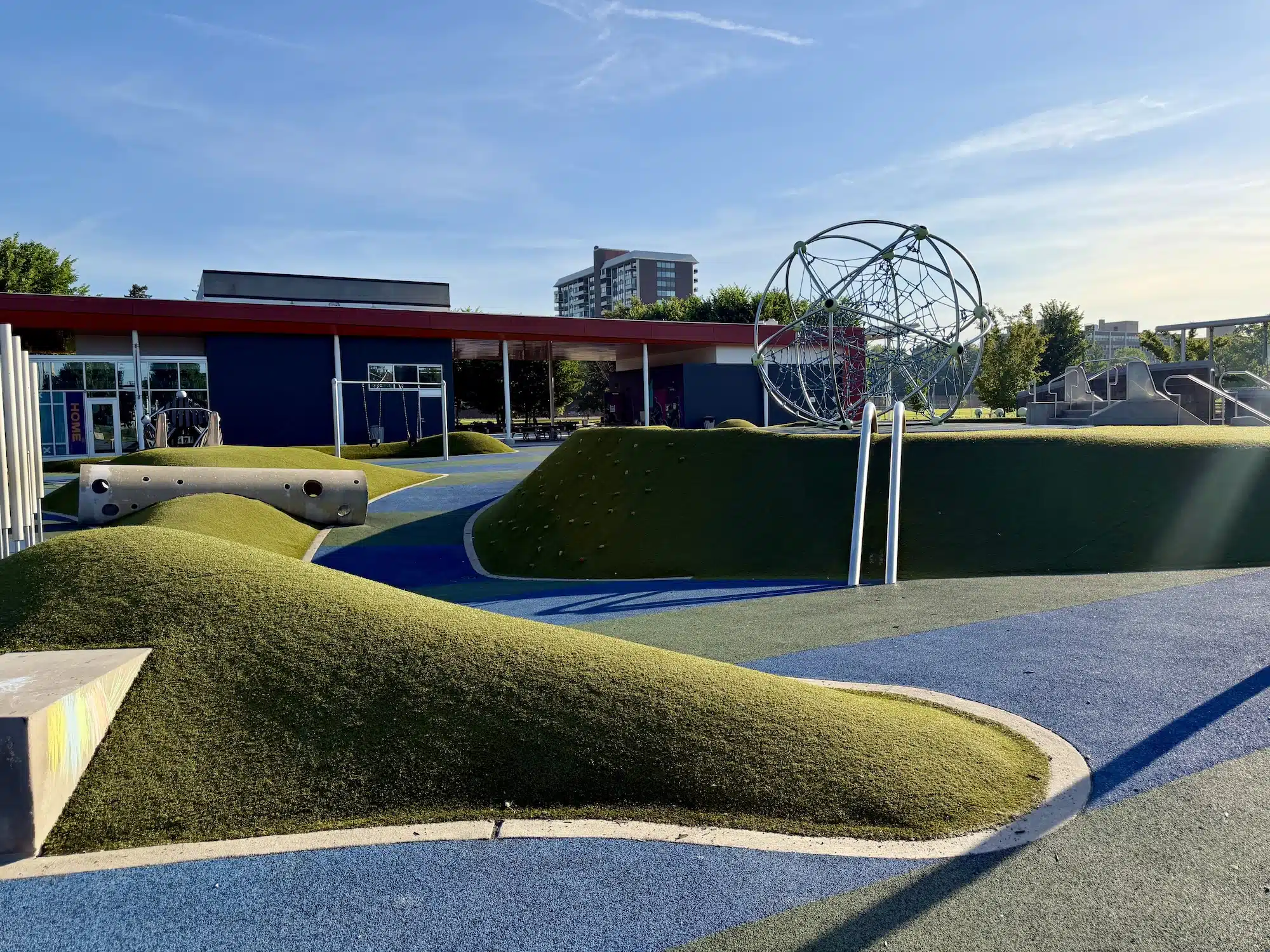 Tarkington Park & Playground in Indianapolis 1 Rolling green play hills and modern playground equipment at Tarkington Park in Indianapolis