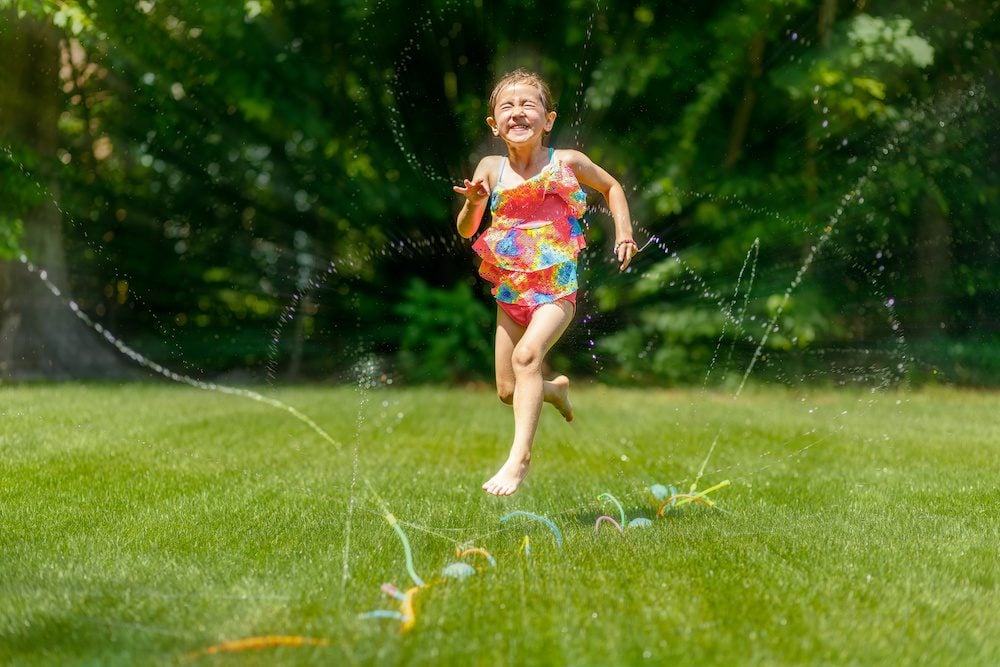 Run through the sprinkler. fun things to do outside in the summer time