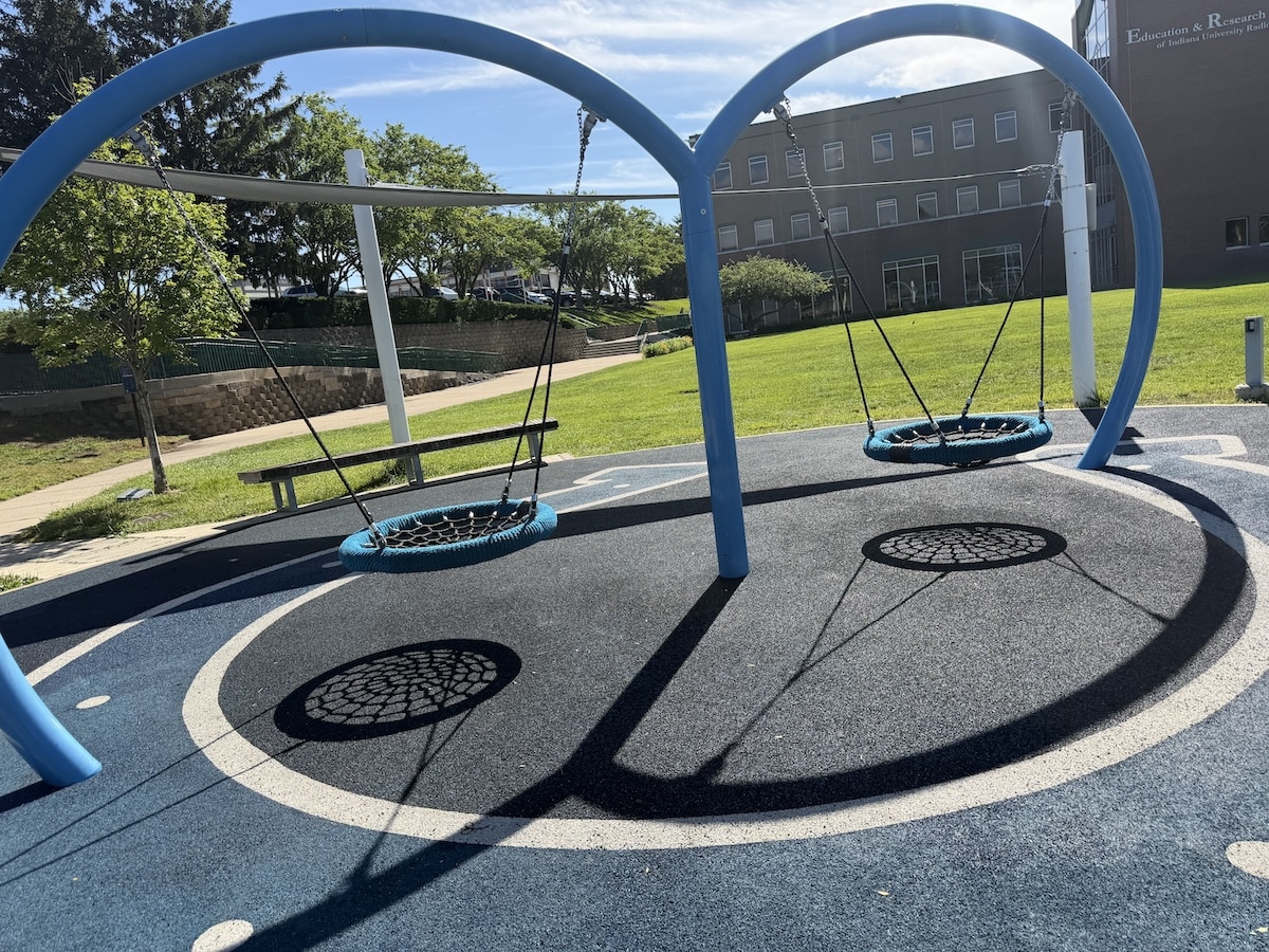 Two spiderweb swings at Colts Canal Playground near the Indianapolis Canal Walk
