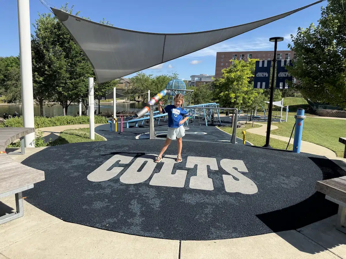 Colts Canal Playspace: A Colts-Themed Playground Downtown 1 Child wearing an Indianapolis Colts shirt at Colts Canal Playground in downtown Indianapolis