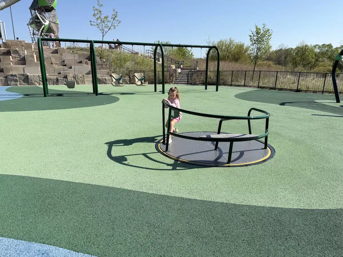 West Park in Carmel: A Year-Round Playground, Splash Pad and Sledding Destination 4 Accessible merry-go-round at West Park playground in Carmel