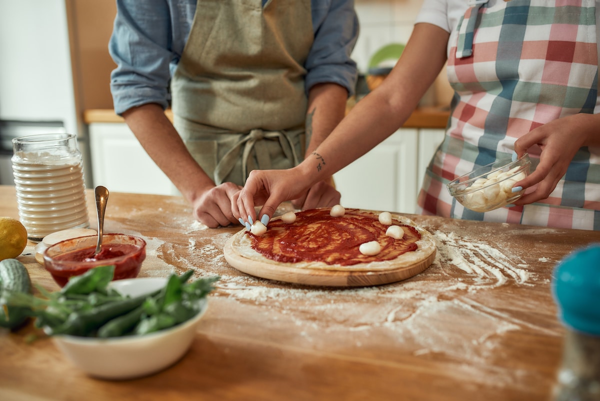 make homemade pizza during an at home date night