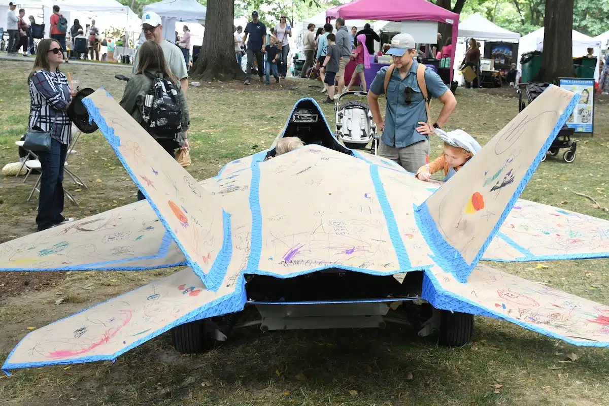 Child creates an art project at the Penrod Arts Fair kids area