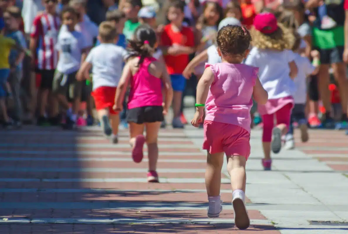 Kids running in a street race