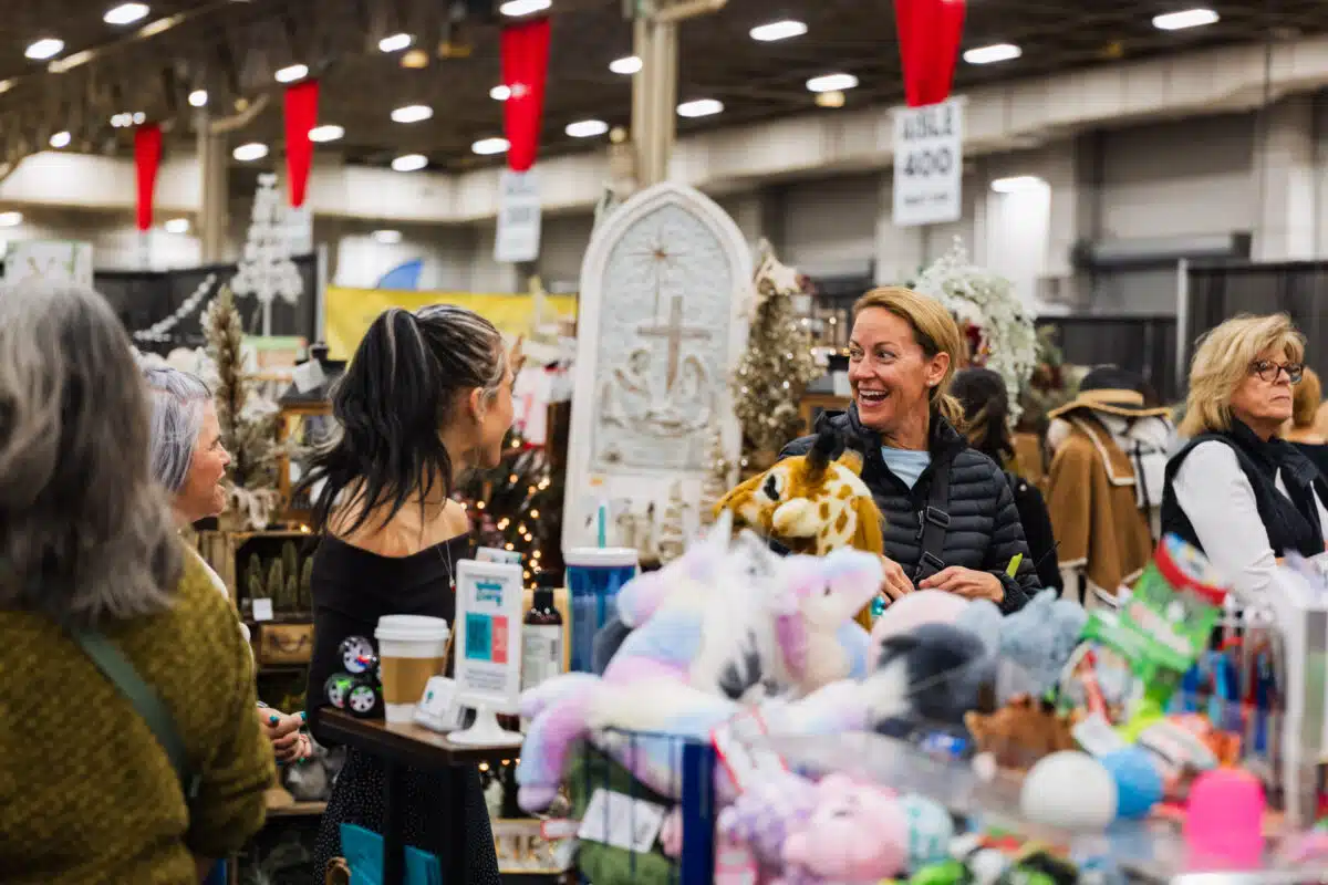 Shoppers browse vendor booths at the Junior League Holiday Mart