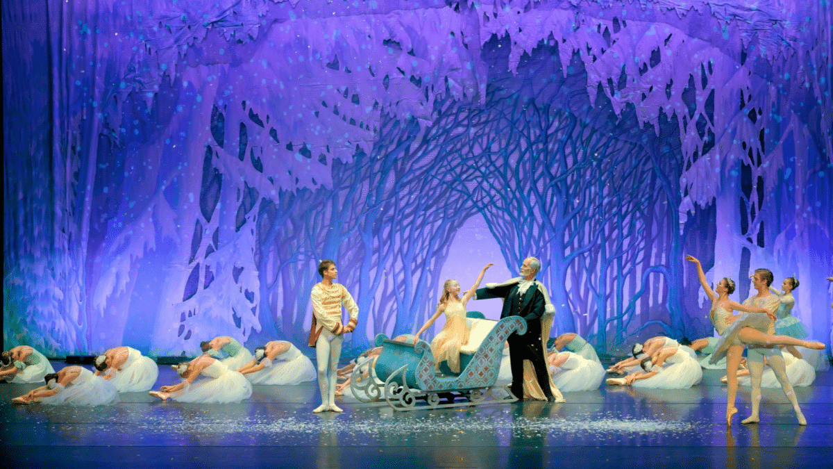 Dancers in a snowy forest scene from The Nutcracker