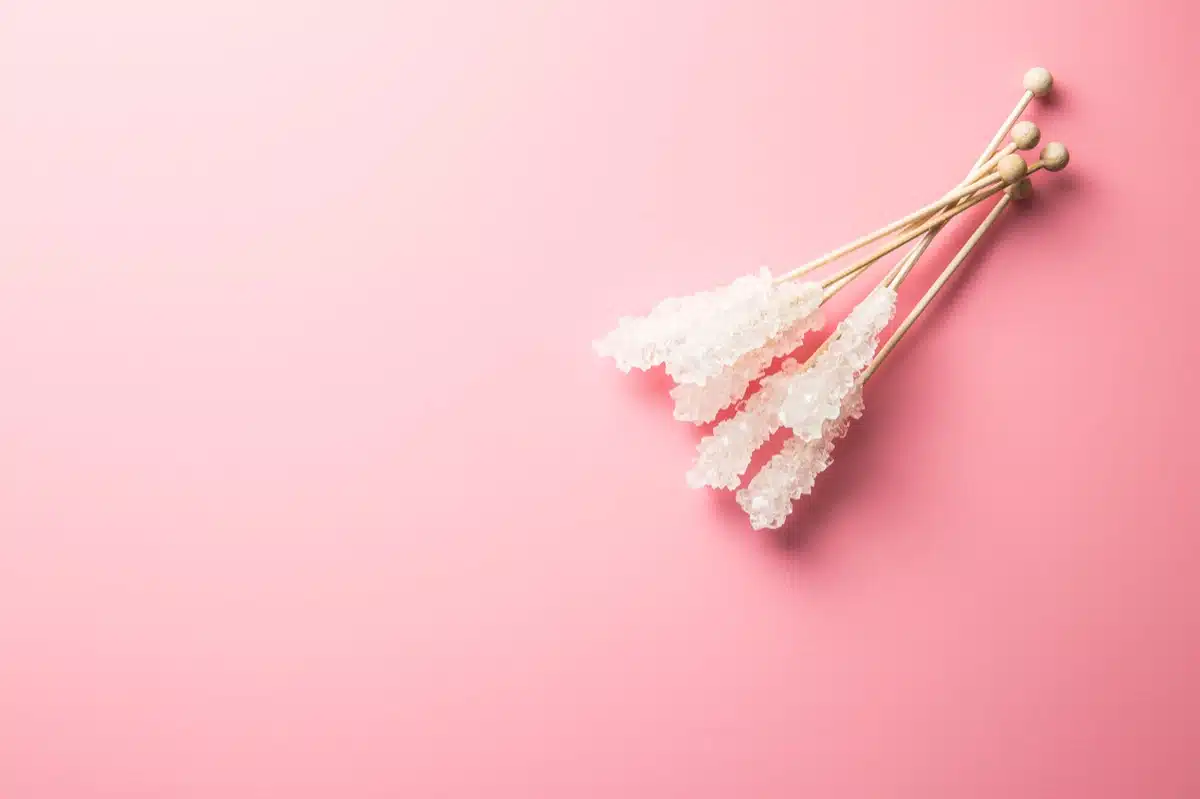 Homemade rock candy crystals on wooden sticks