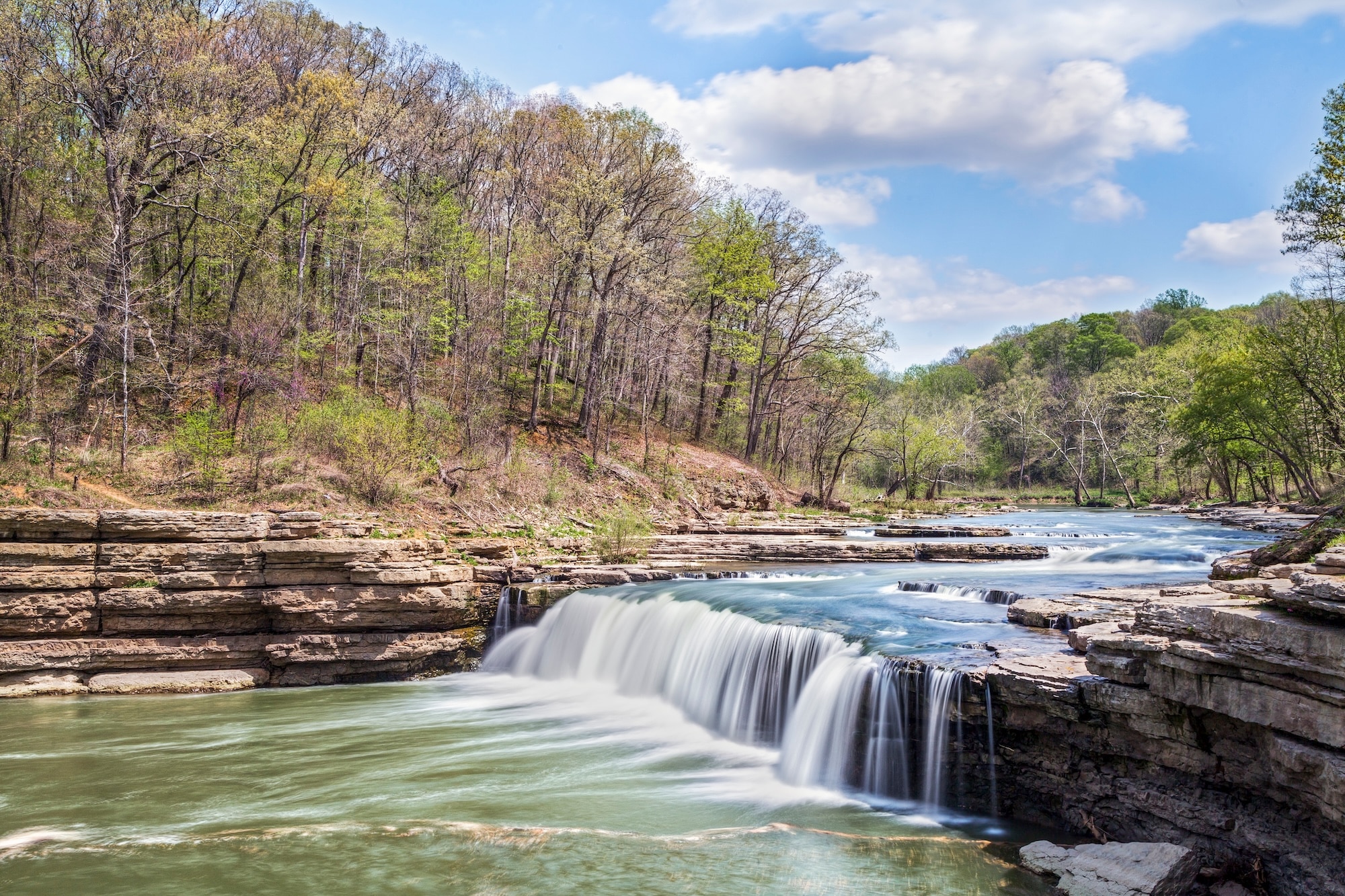 Lower Cataract Falls flowing over rock ledges near Spencer, Indiana in spring