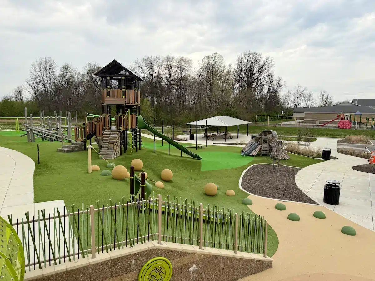 Aerial view of Grassy Creek Park playground in Indianapolis showing rolling hills built into the play structures