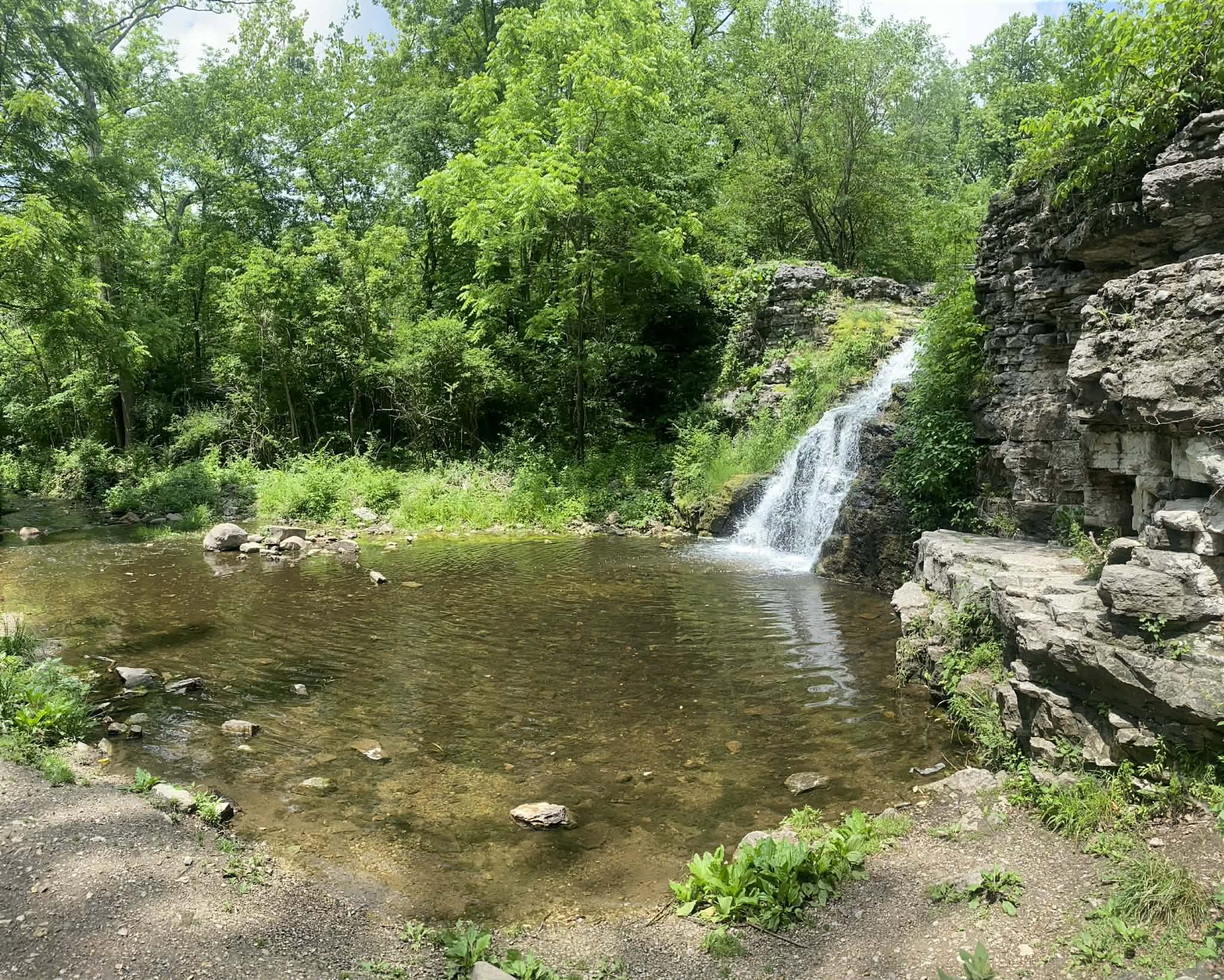 France Park waterfall flowing beside quarry rocks in Logansport, Indiana