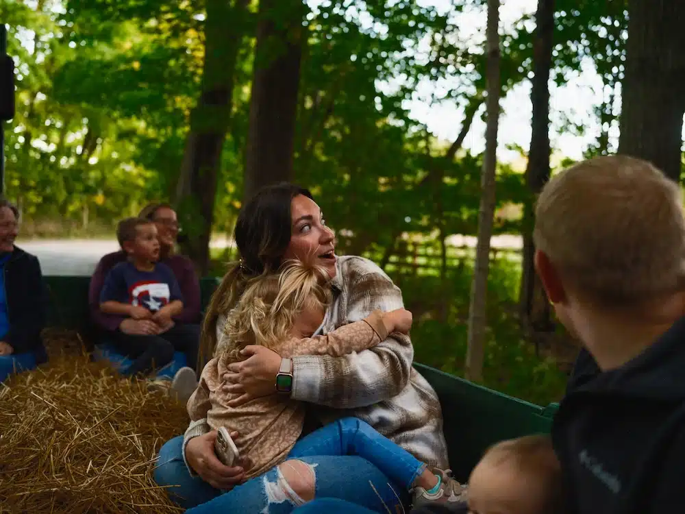 The Headless Horseman at Conner Prairie 2025 - Parents' Guide 3 little girl sitting on her moms lap scared during headless horseman