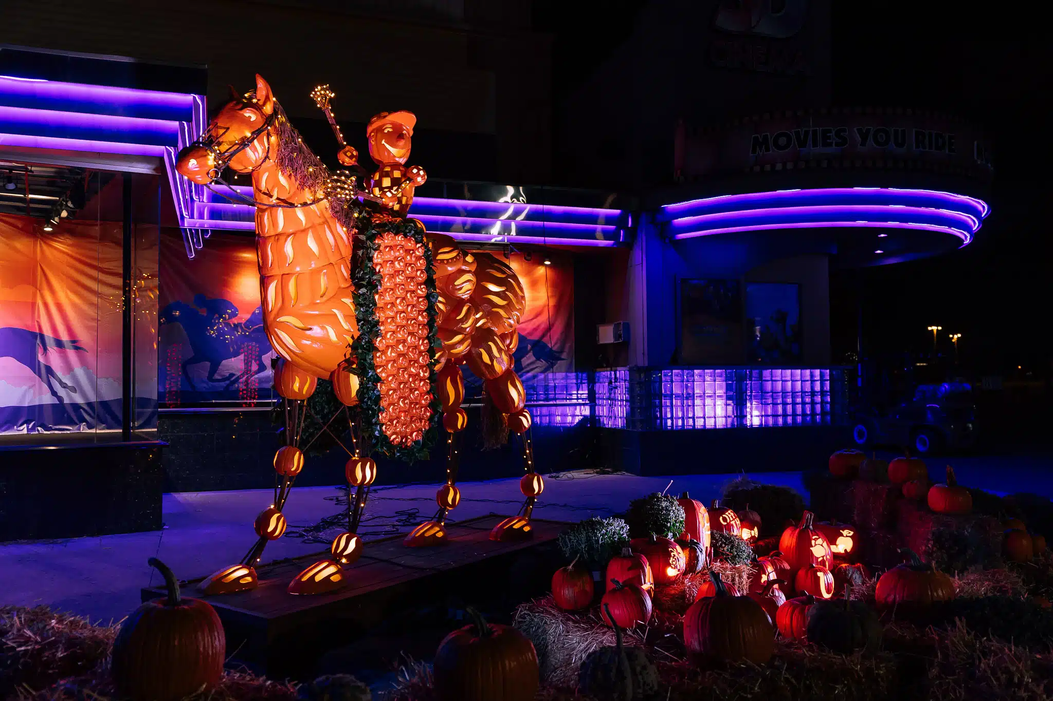 Illuminated Kentucky Derby jockey pumpkin display at Pumpkins at Kentucky Kingdom