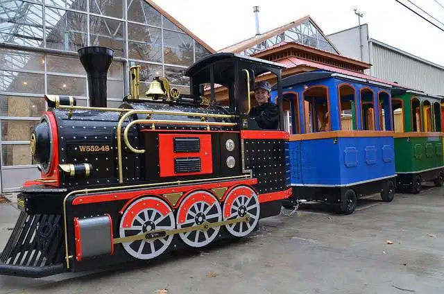 Miniature Sullivan Express train with a black engine and blue and green cars at Sullivan Hardware in Indianapolis