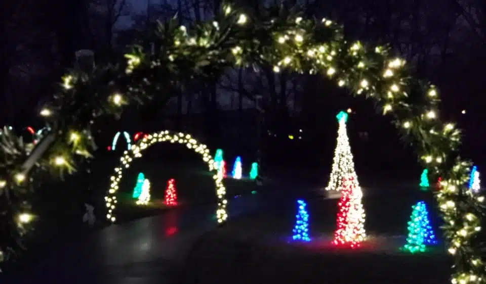 Best Christmas Lights in Indianapolis 2026 8 The Lighted Trail at Amphitheater Park in Greenwood with an illuminated bridge and light arches