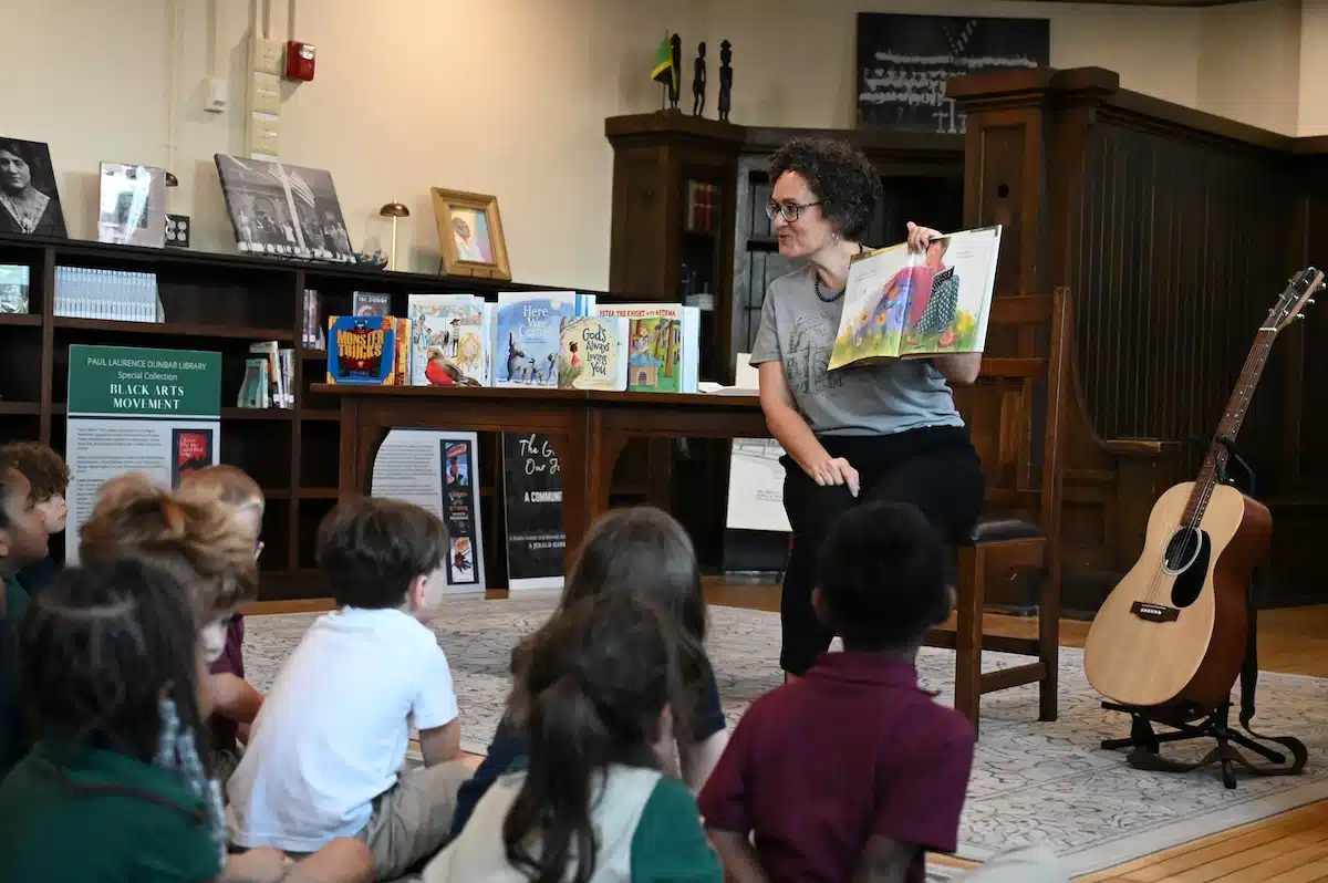 Students listening to a read-aloud in the Paul Laurence Dunbar Library at The Oaks Academy