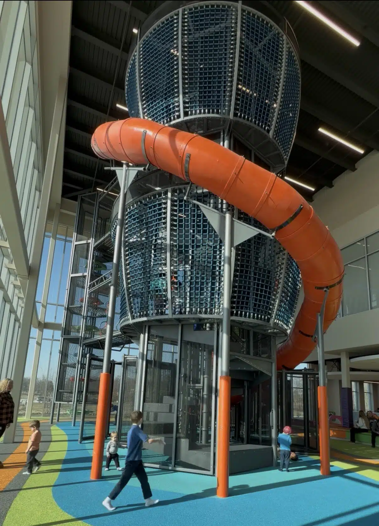 Fast enclosed slide at the Fishers Community Center indoor playground for kids in Fishers, Indiana