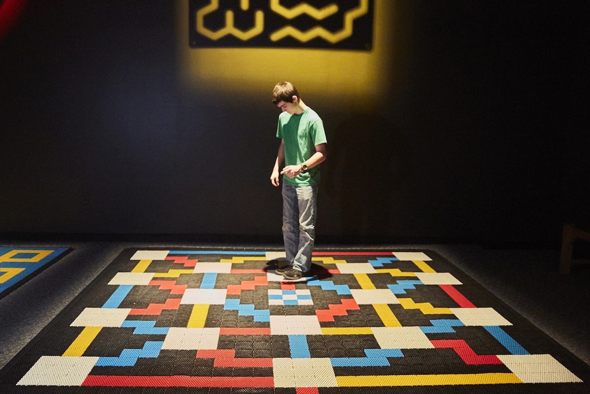 Mazes & Brain Games at the Indiana State Museum 3 Family exploring the Mathematical Maze activity in the Mazes & Brain Games exhibit at the Indiana State Museum