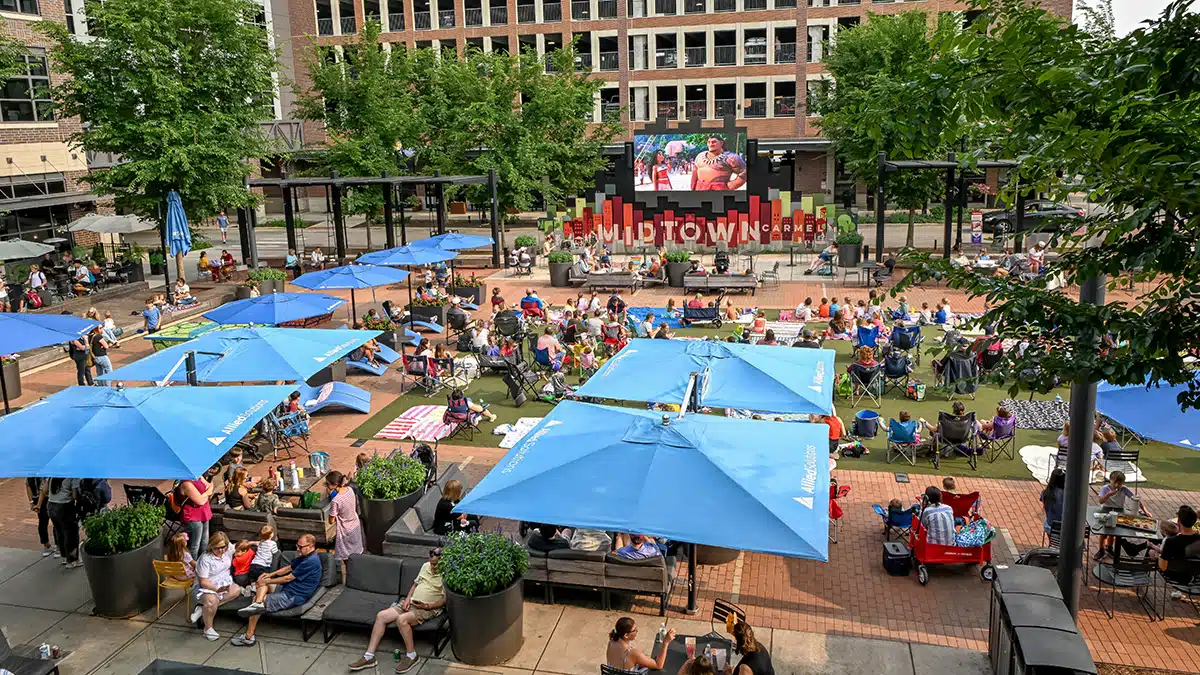 Carmel’s Huge New Monon Boulevard Playground 8 Midtown Plaza in Carmel with lawn seating and the outdoor video screen