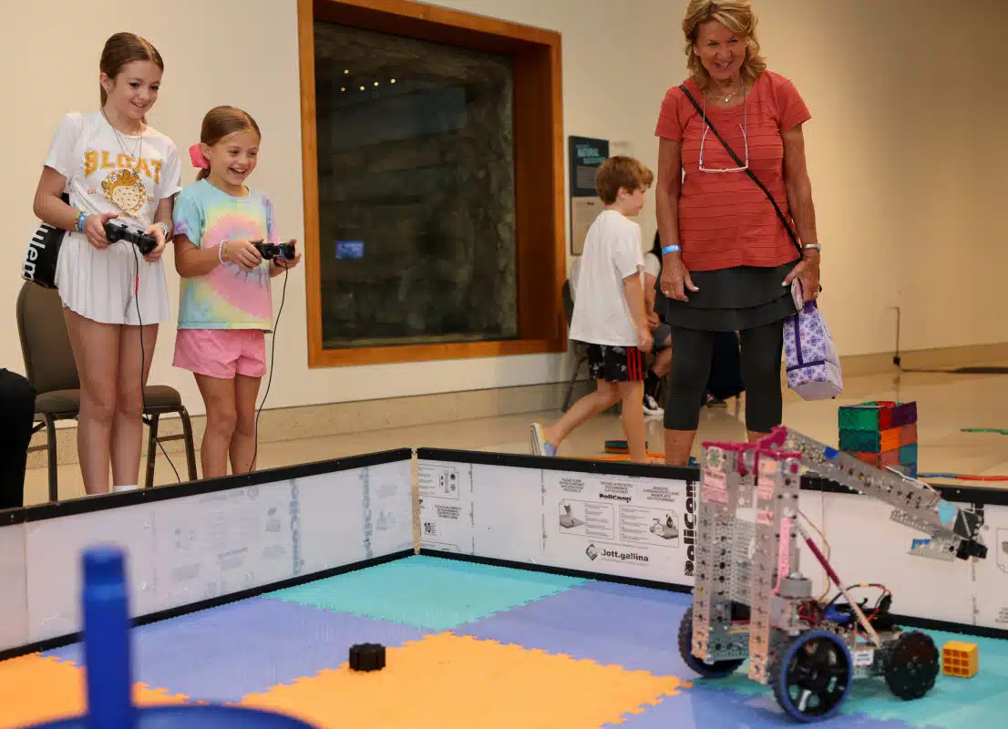 Things to Do This Weekend in Indianapolis with Kids | September 18-20, 2026 3 Children and adults watching a robot demonstration at Tinkerfest at the Indiana State Museum
