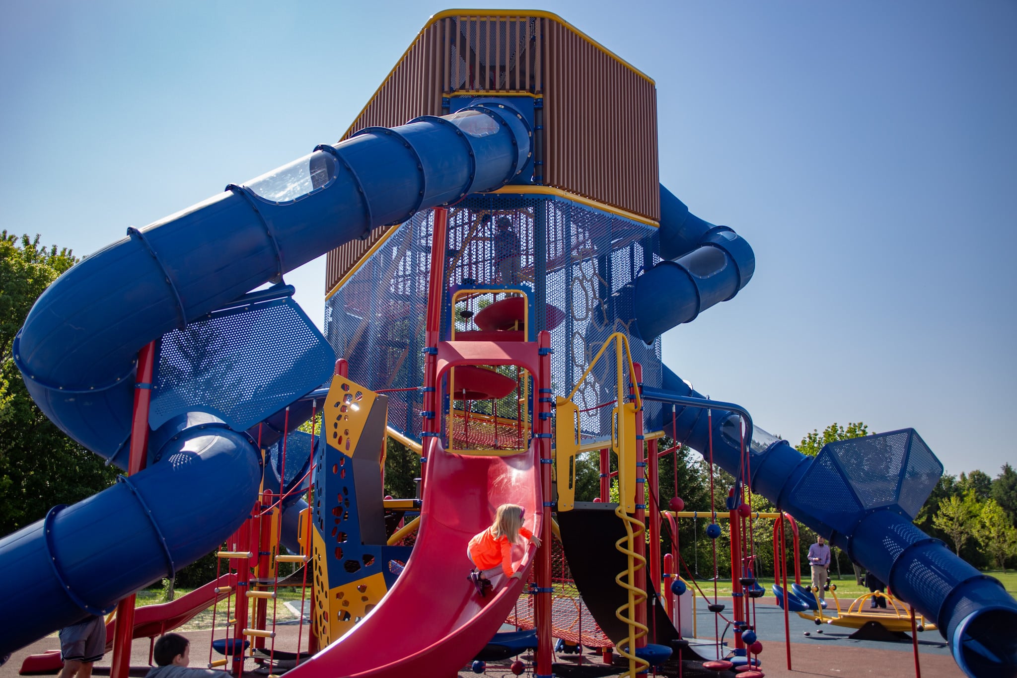 Tall multi-level playground tower with tube slides at Thompson Park in Indianapolis