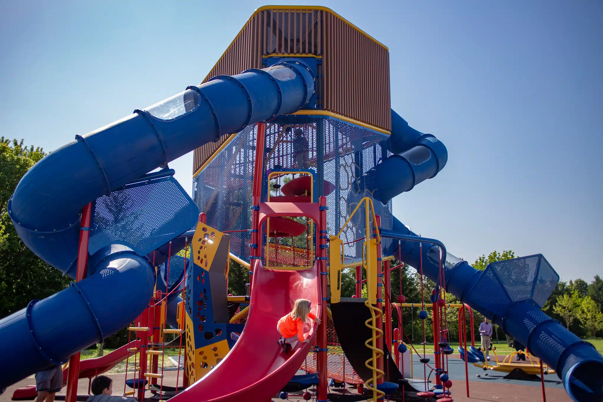 Tall multi-level playground tower with tube slides at Thompson Park in Indianapolis