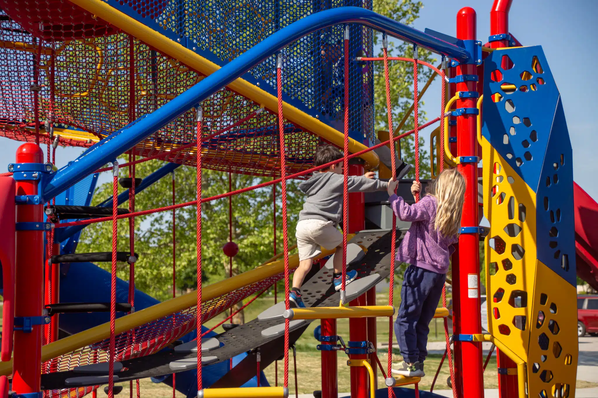 Children climbing and playing on the new Thompson Park playground in Indianapolis