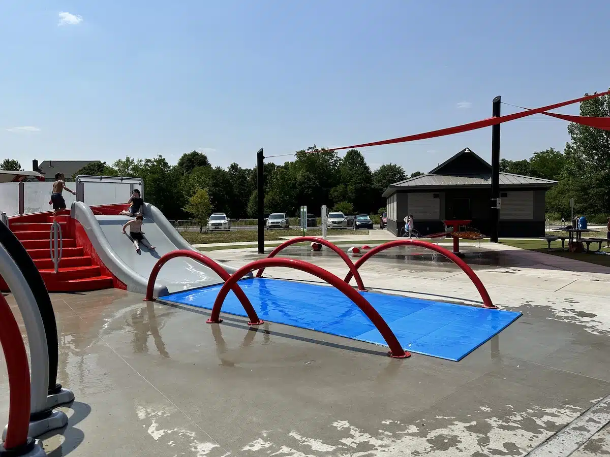 Lawrence W. Inlow Park Splash Pad in Carmel 5 slide with Lawrence W. Inlow Park in Carmel Splash Pad bathrooms and shade behind slide