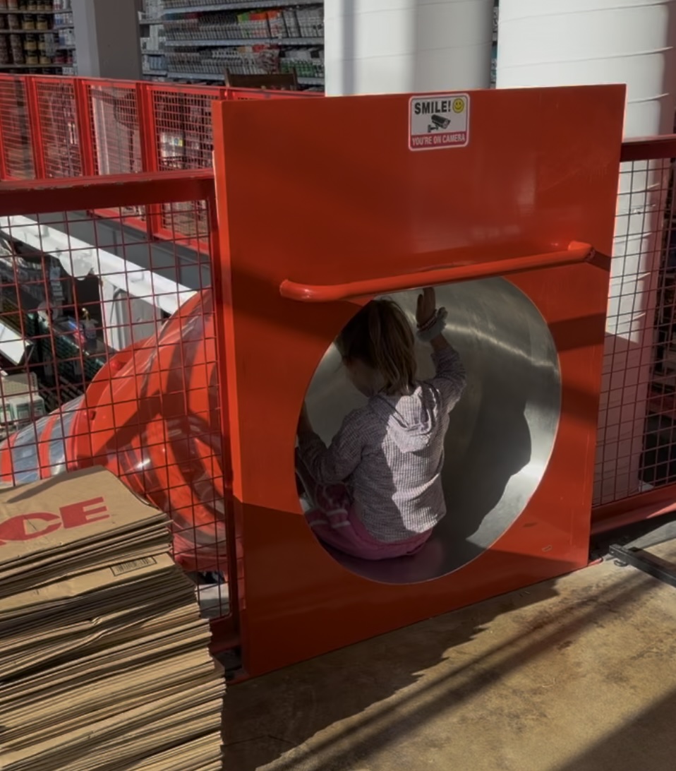 Ace Hardware With a Slide Inside in Indianapolis 2 Child getting ready to go down the spiral slide inside Benge's Ace Hardware in Butler-Tarkington