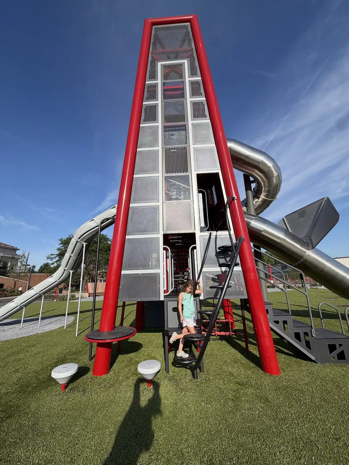 Carmel’s Huge New Monon Boulevard Playground 2 Tall red tower and enclosed bridge at Up and Down the Monon playground in Carmel