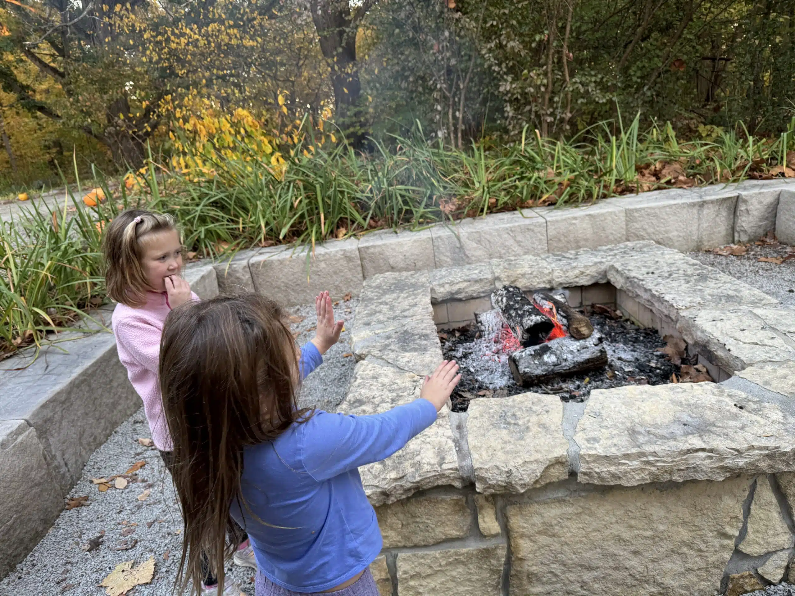 Hauntless Halloween at Holliday Park: A Parent Review 8 Girls making s'mores at the Hauntless Halloween campfire at Holliday Park