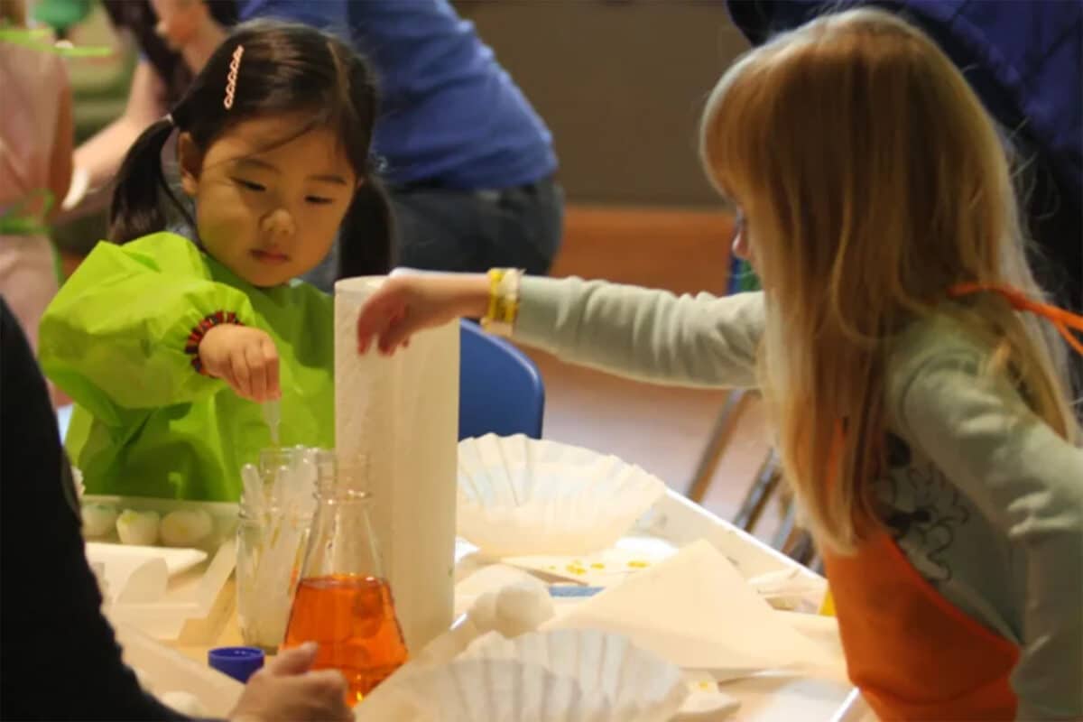 Children doing a messy art activity at a table