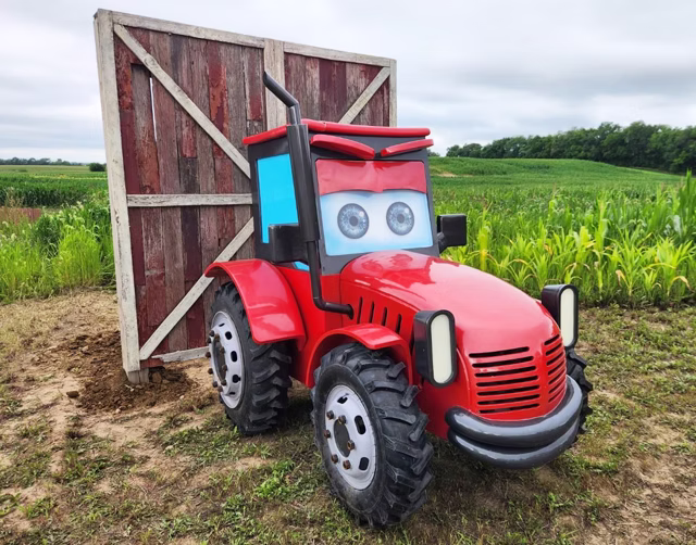 Red tractor play structure at Harvest Tyme Family Farm