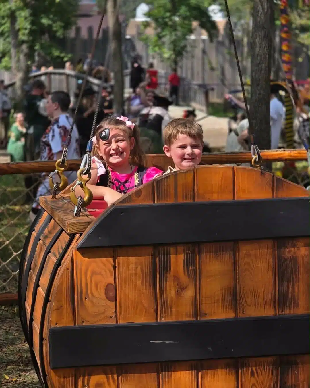 Ohio Renaissance Festival: A Day Trip From Indy With Kids 8 Children enjoying a ride at the Ohio Renaissance Festival