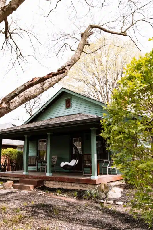 A Heart Rock Justus Family Recovery Center house with a covered front porch