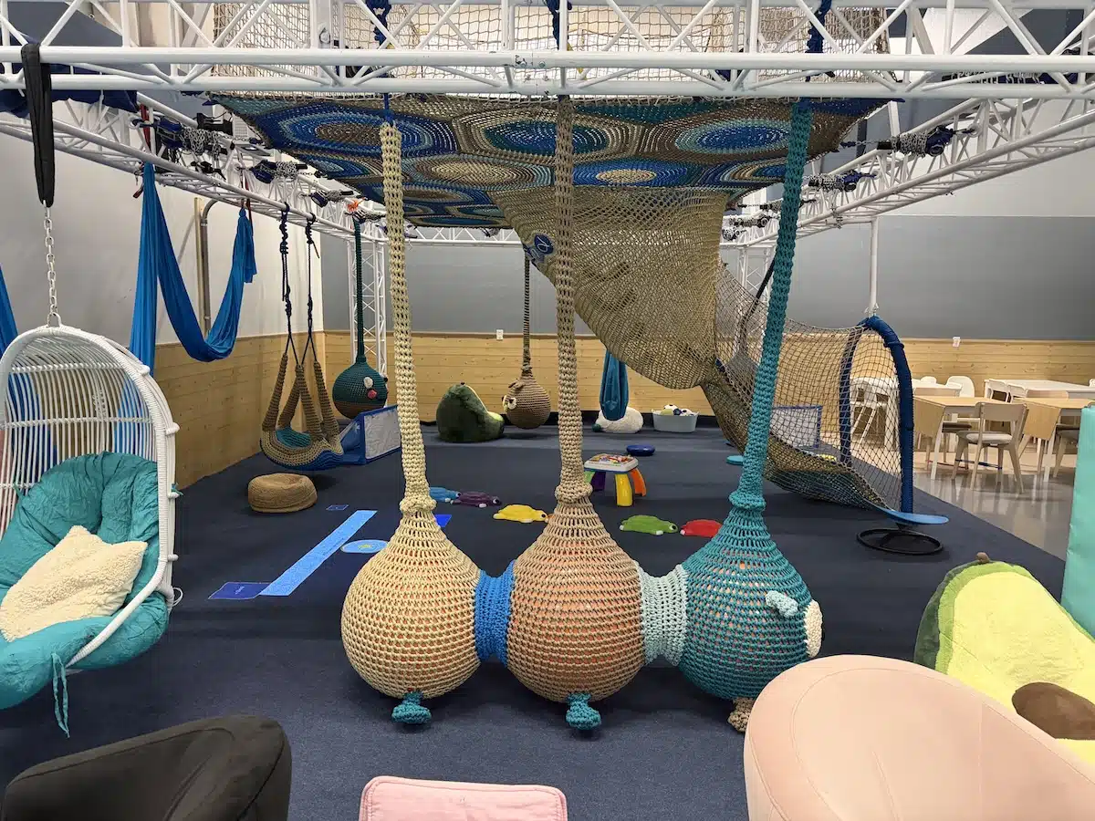 Inside Prana Play, a Sensory-Friendly Play Space in Carmel 1 Woven climbing net, sensory swings and fabric silks at Prana Play in Carmel