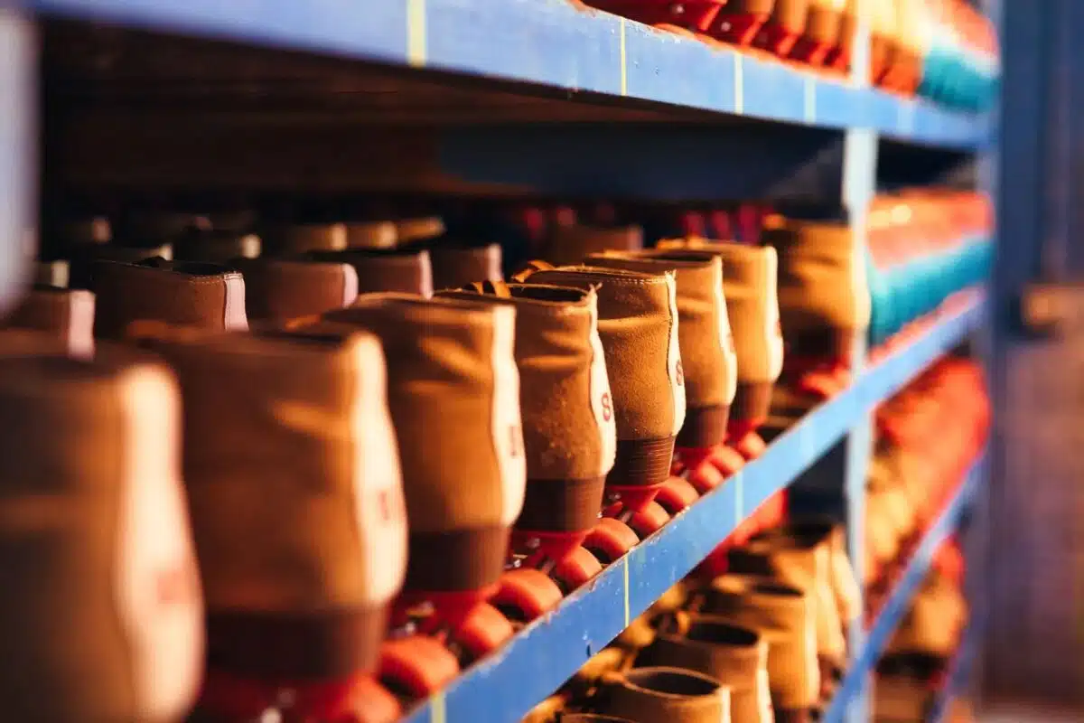 Rows of rental roller skates on shelves at a roller rink